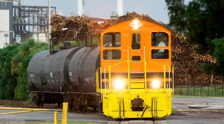 Train pulling tank cars