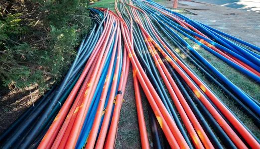 Blue and red fiber-optic cables on the ground